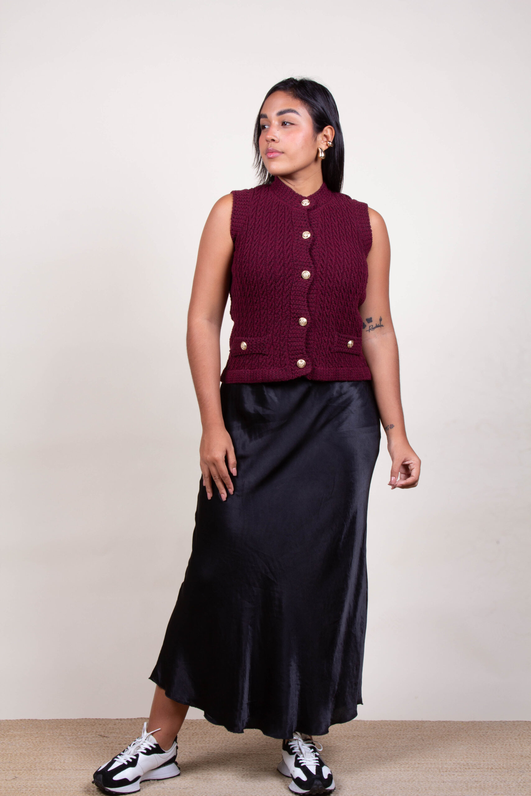 Chalecos con botones dorados